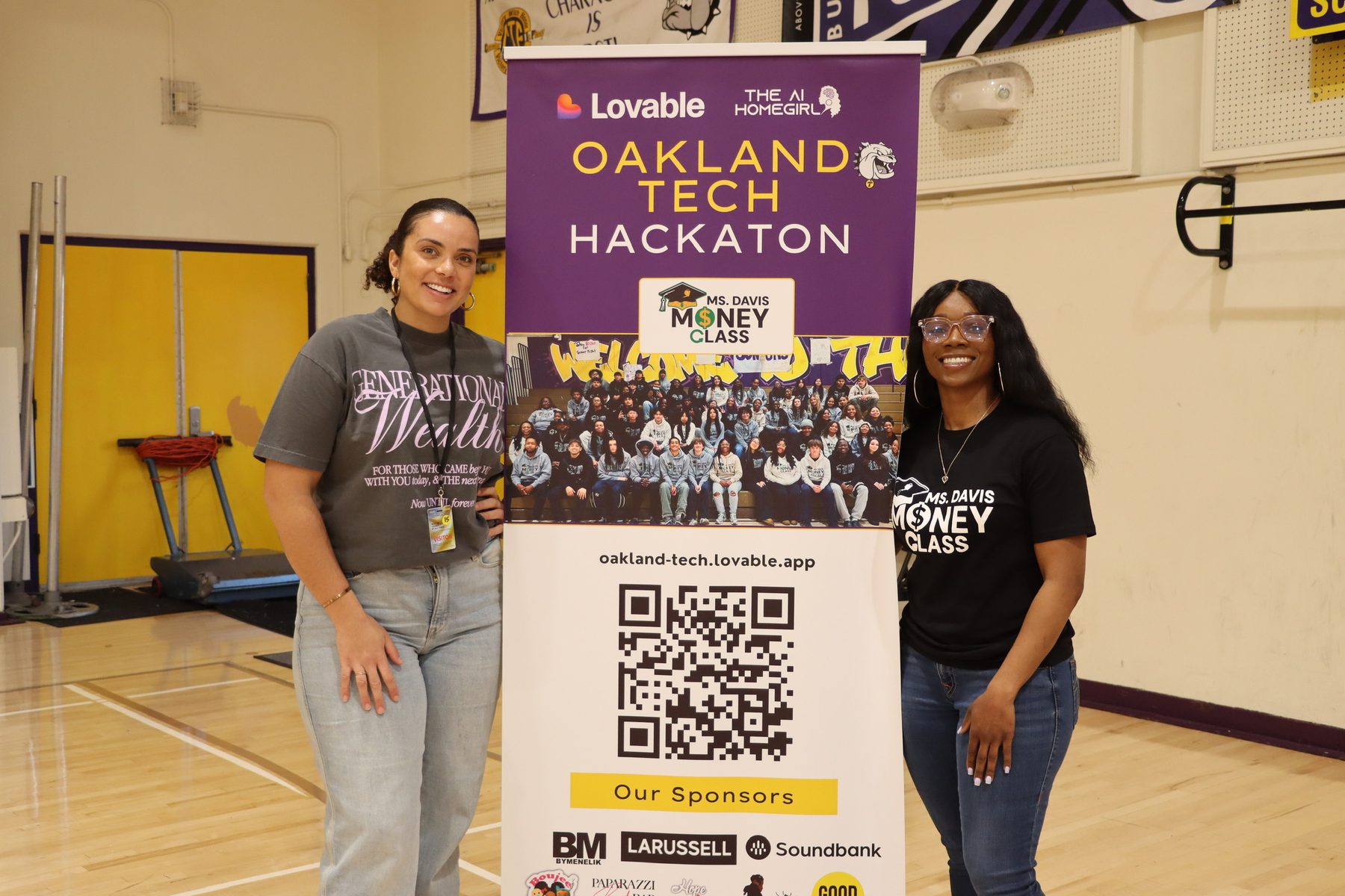 Hackathon organizers at the Oakland Tech Hackathon event banner